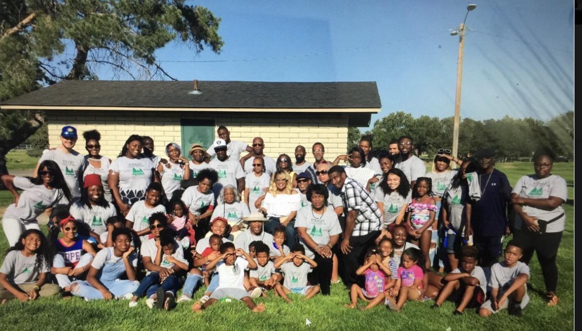 Steward family reunion group photo with dozens of family members gathered outdoors
